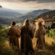 Firefly old Italian Christians praying in mountain looking off at old house back turned 65822